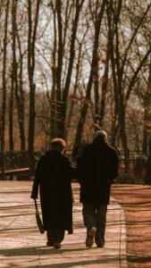 Elderly couple walking in a park
